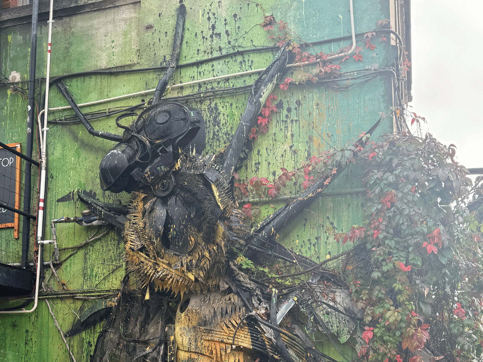 Street art  Tour, mural with layered textures by Vhils at LX Factory, Lisbon